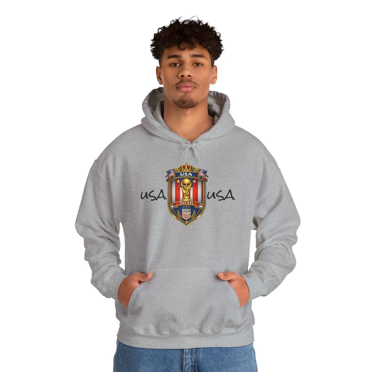 Model wearing a gray USA World Cup 2026 hoodie with crest emblem and front pocket.